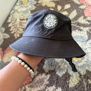 Rip Curl Black Bucket Hat with White Logo Patch. Surf bucket hat.